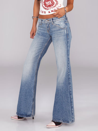 Flared Denim Jeans With A Retro Y2K Vibe Featuring A Washed And Distressed Finish For A Cool Edgy Look
